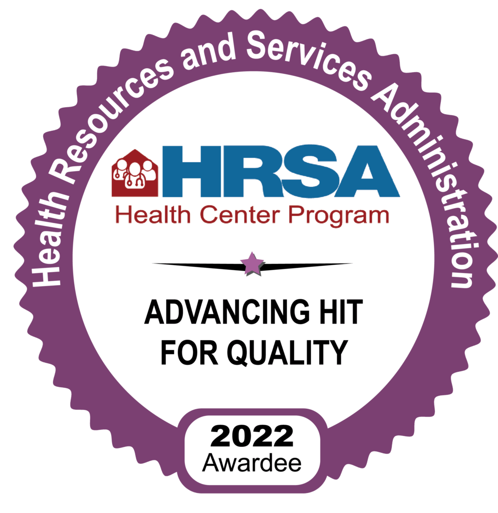 Purple badge reading Health Resources and Services Administration, HRSA Health Center Program, Advancing HIT for Quality, with a 2022 Awardee label at the bottom.
