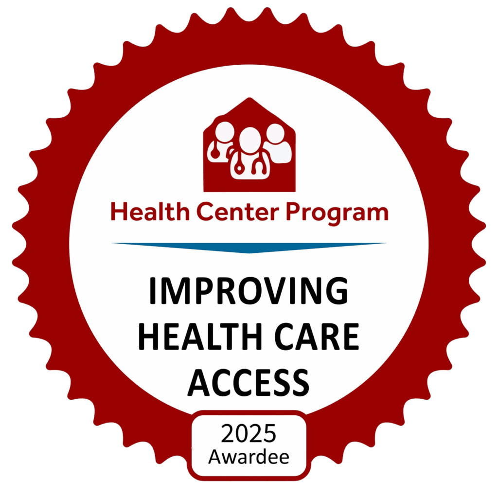 A red and white badge with the text Health Center Program IMPROVING HEALTH CARE ACCESS 2025 Awardee and an icon of people in a clinic above the text.