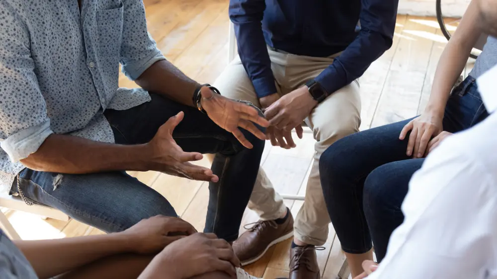 overhead shot of people sitting in a circle